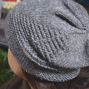 Women wearing Aviary Hat Pattern knit in gray